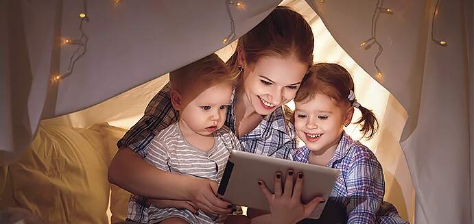  Family looking at tablet